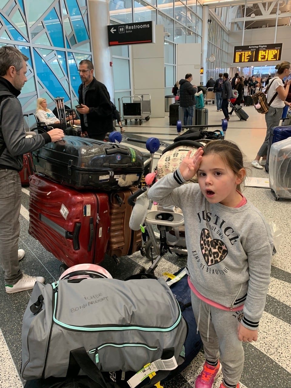 Lola Icher at the airport with some of the family luggage.