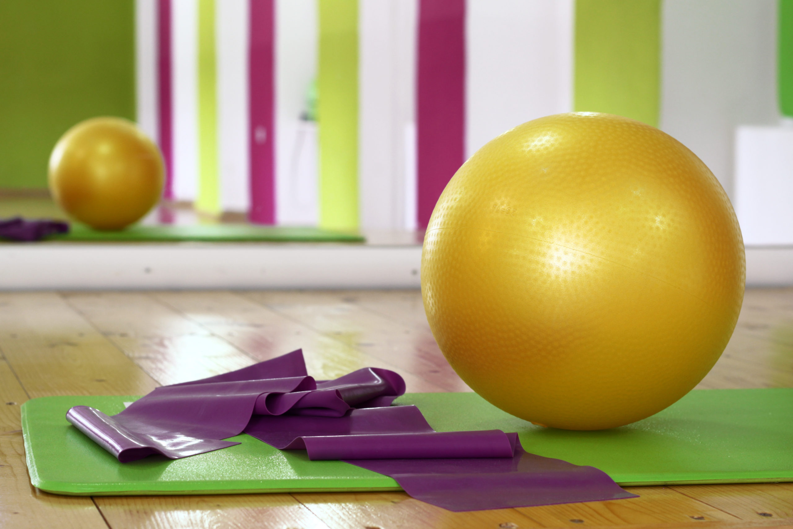 Canva-Pilates-Ball-on-a-Yoga-Mat